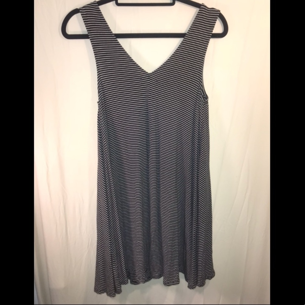 Black and white striped sleeveless dress.